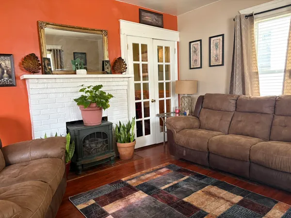 a living room with furniture fireplace and flat screen tv