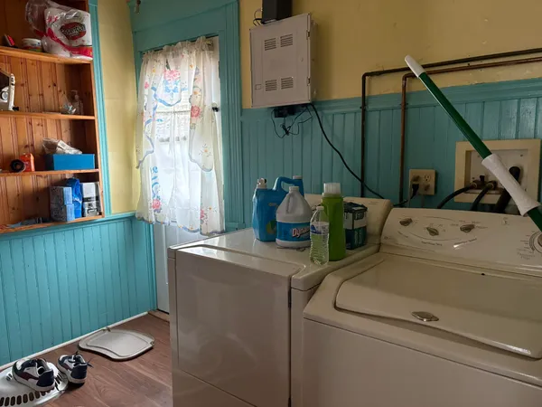 a bedroom with bed and window