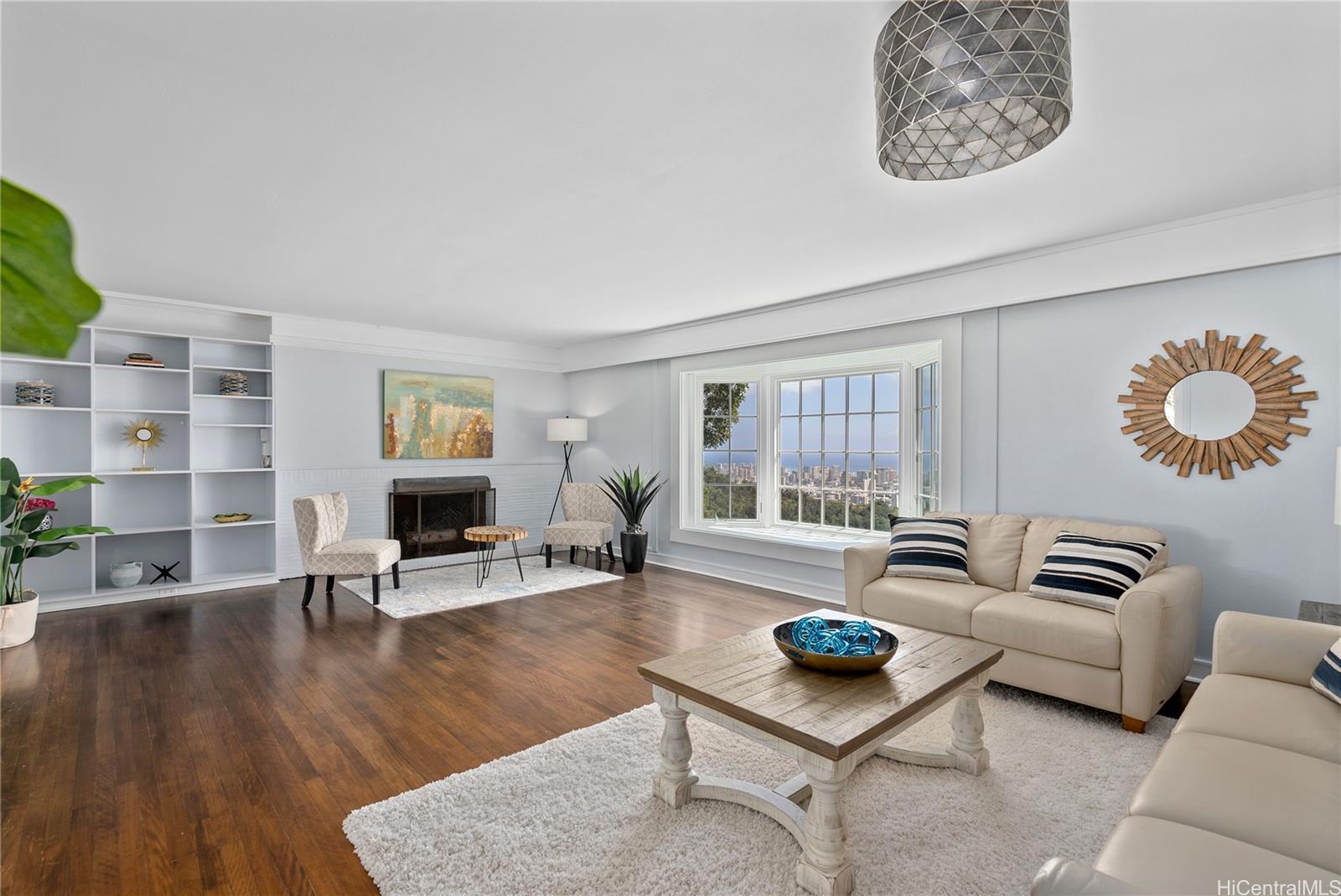 3290 Pacific Heights Road Honolulu, HI 96813 - Photo 1 of 1 a living room with furniture and a wooden floor
