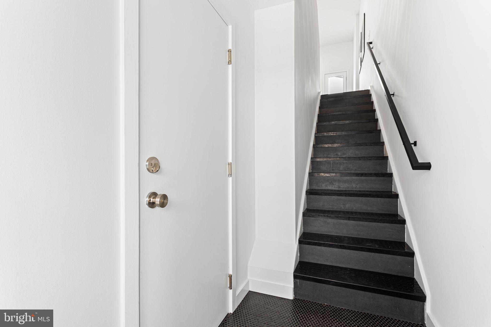 239 Krams Avenue Philadelphia, PA 19128 - Photo 37 of 54 Foyer inside front door with stairs to 2nd floor