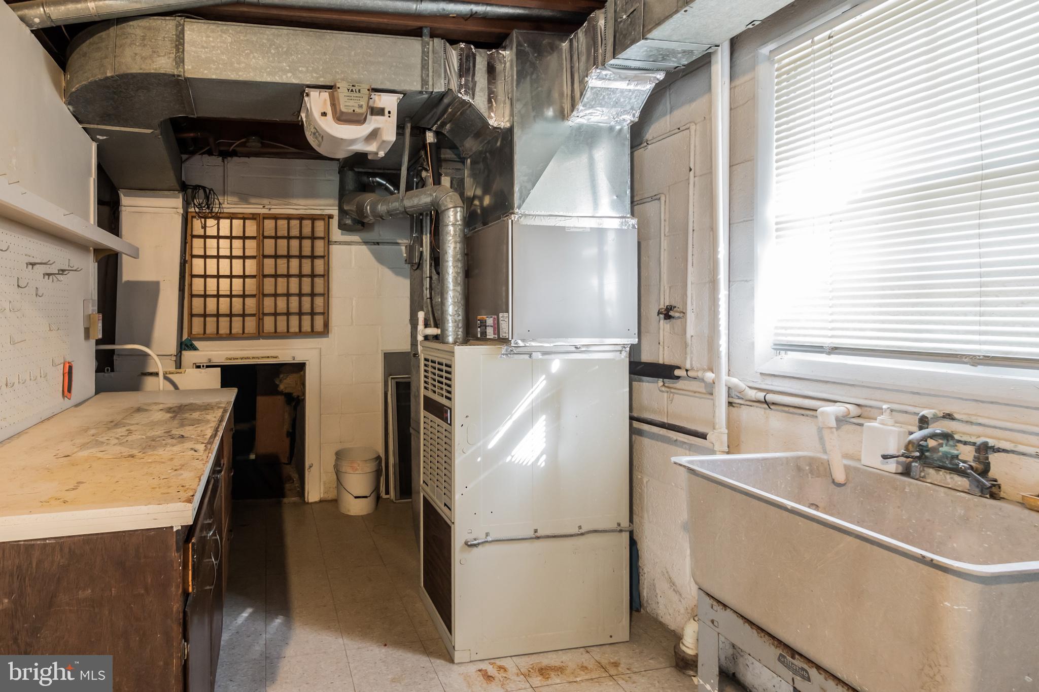 4201 Elby Street Silver Spring, MD 20906 - Photo 27 of 30 Pass Utility Sink and Furnace to Crawl Space