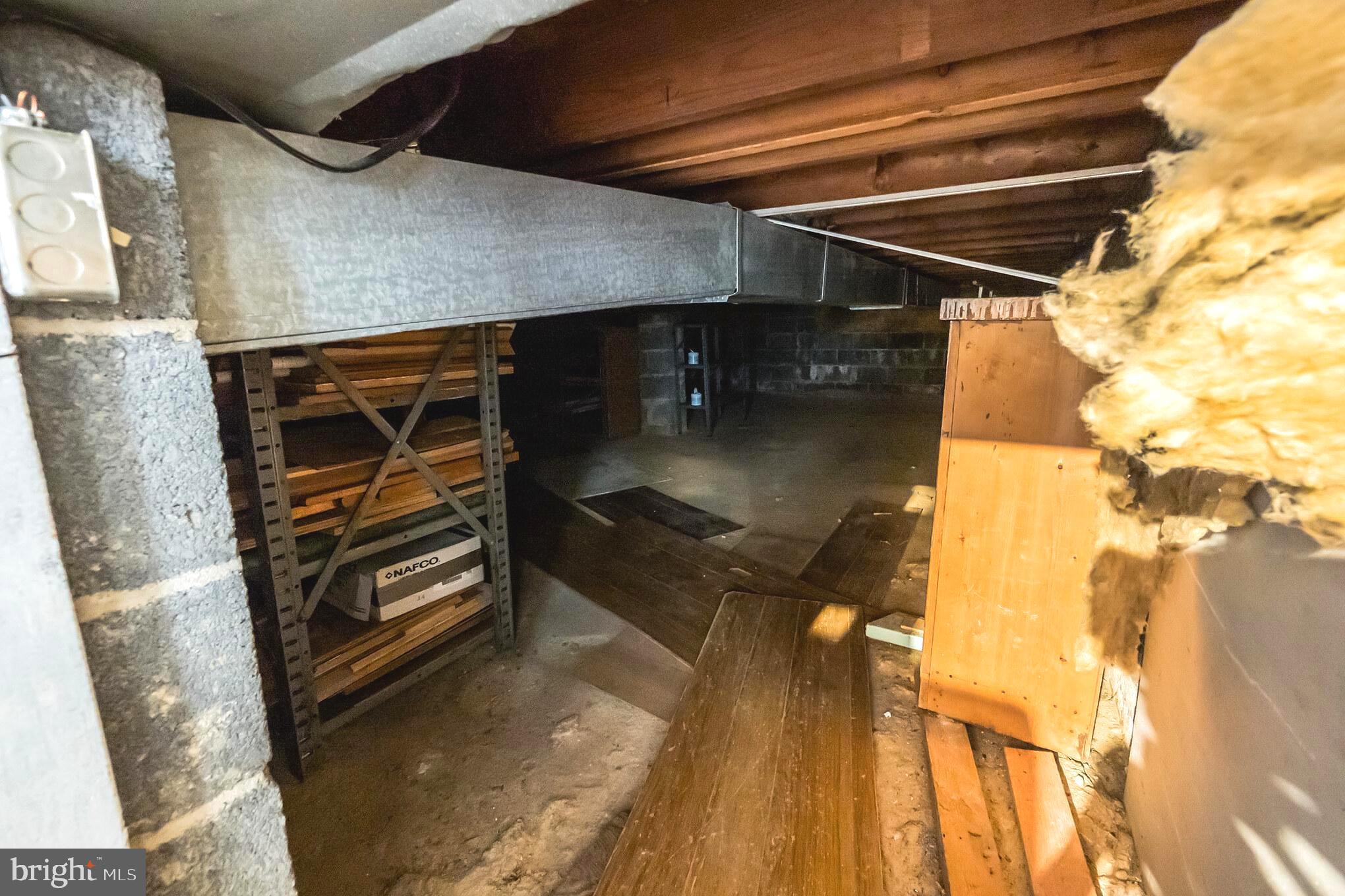 4201 Elby Street Silver Spring, MD 20906 - Photo 28 of 30 Crawl Space with Cement Floor and Lots of Shelving