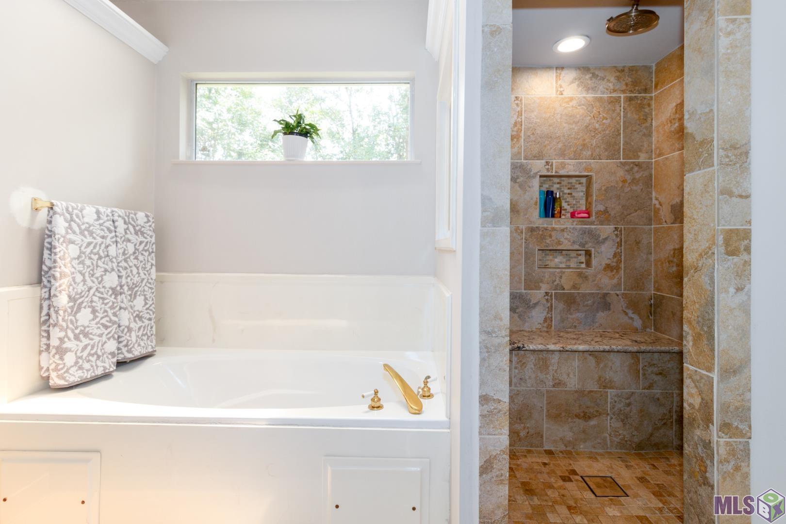 531 Woodgate Boulevard Baton Rouge, LA 70808 - Photo 21 of 32 Primary bath with updated shower stall