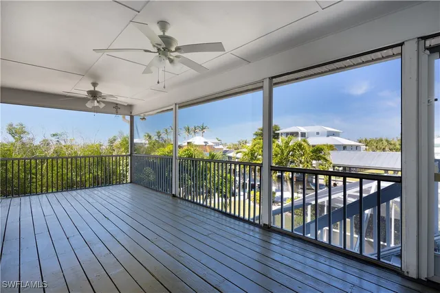 a view of a porch with wooden floor
