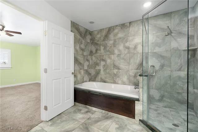 a bathroom with a bathtub and a shower