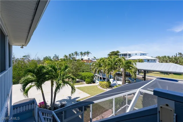 a view of building with palm trees