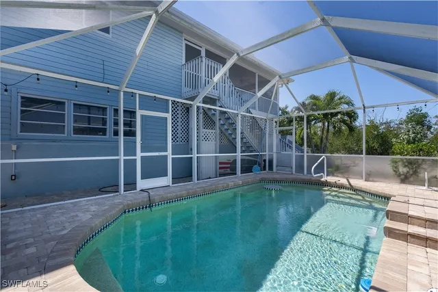 a view of a house with a backyard