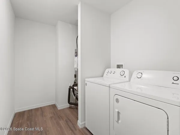 a view of storage and utility room with washer and dryer
