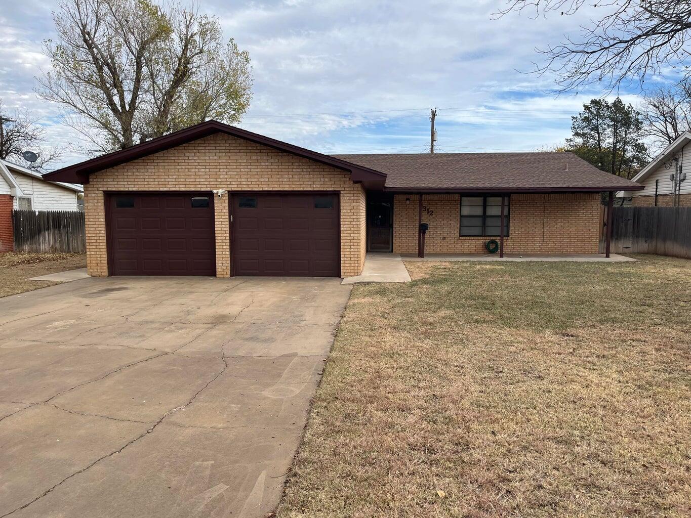 a house with yard in front of it