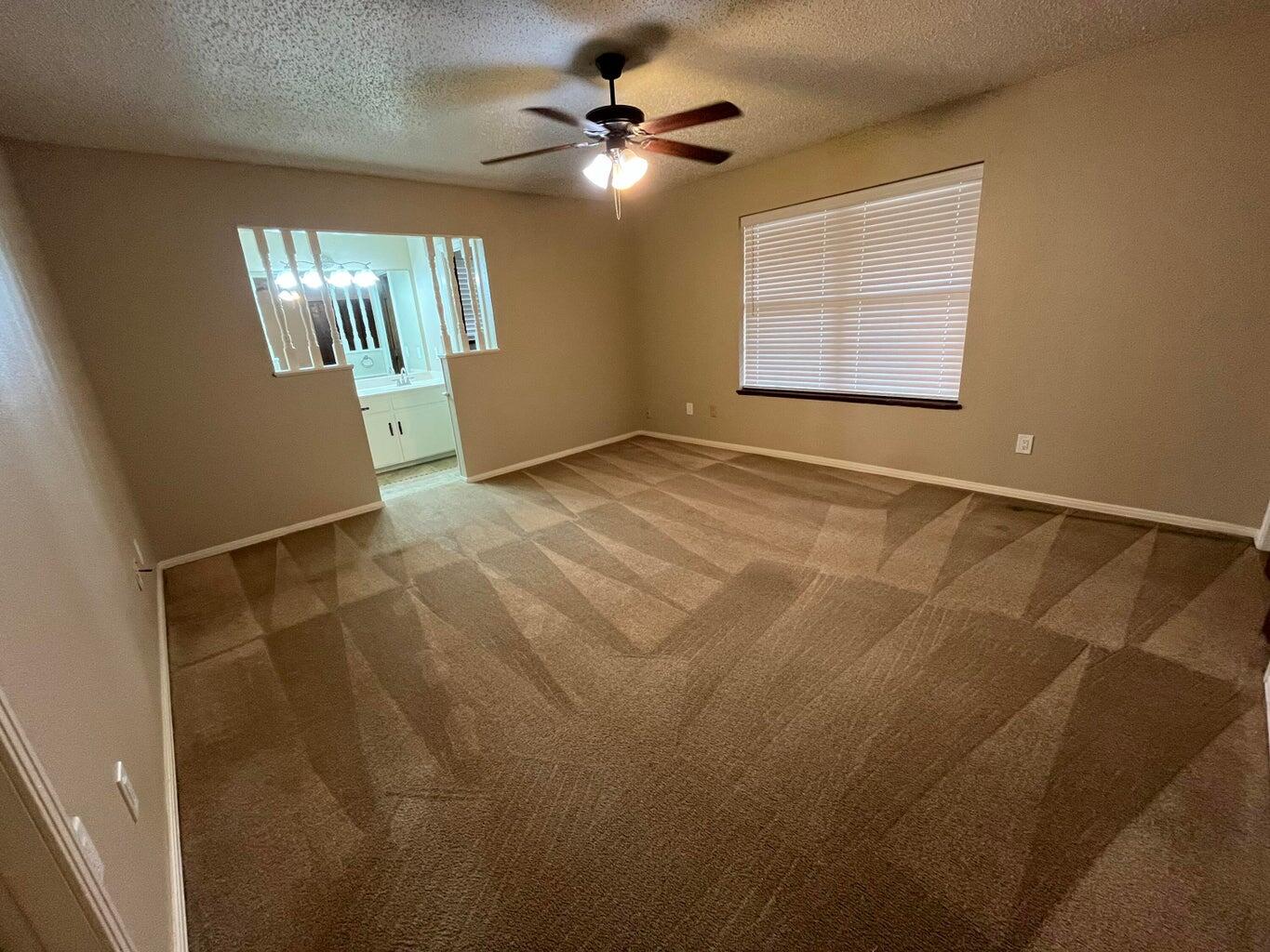 1312 Yonkers Street Plainview, TX 79072 - Photo 11 of 25 a view of an empty room with a window