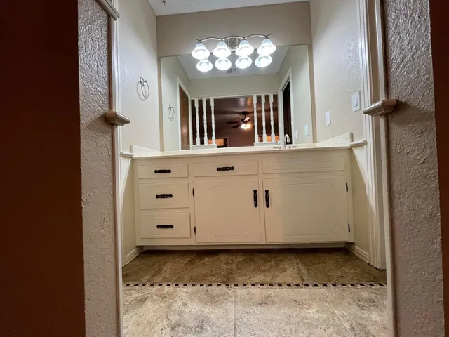 a bathroom with a tub and a shower