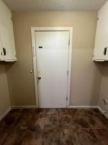 a house that has a tree in front of it