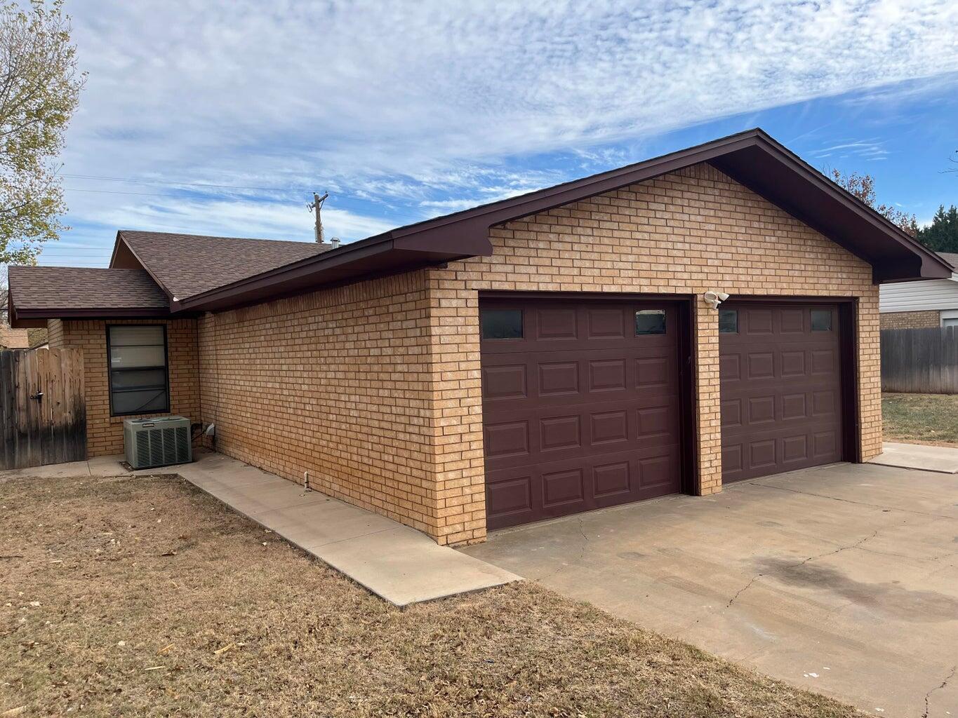 1312 Yonkers Street Plainview, TX 79072 - Photo 2 of 25 a view of a house with a garage