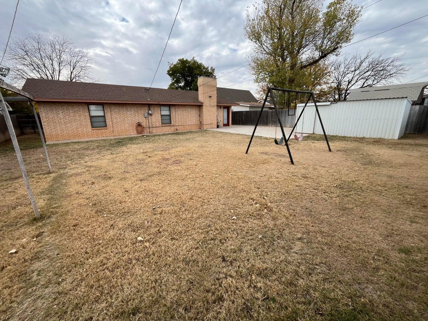 1312 Yonkers Street Plainview, TX 79072 - Photo 22 of 25 a house that has a tree in front of it