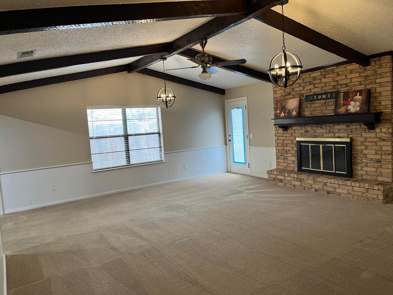 1312 Yonkers Street Plainview, TX 79072 - Photo 4 of 25 a view of a livingroom with a fireplace