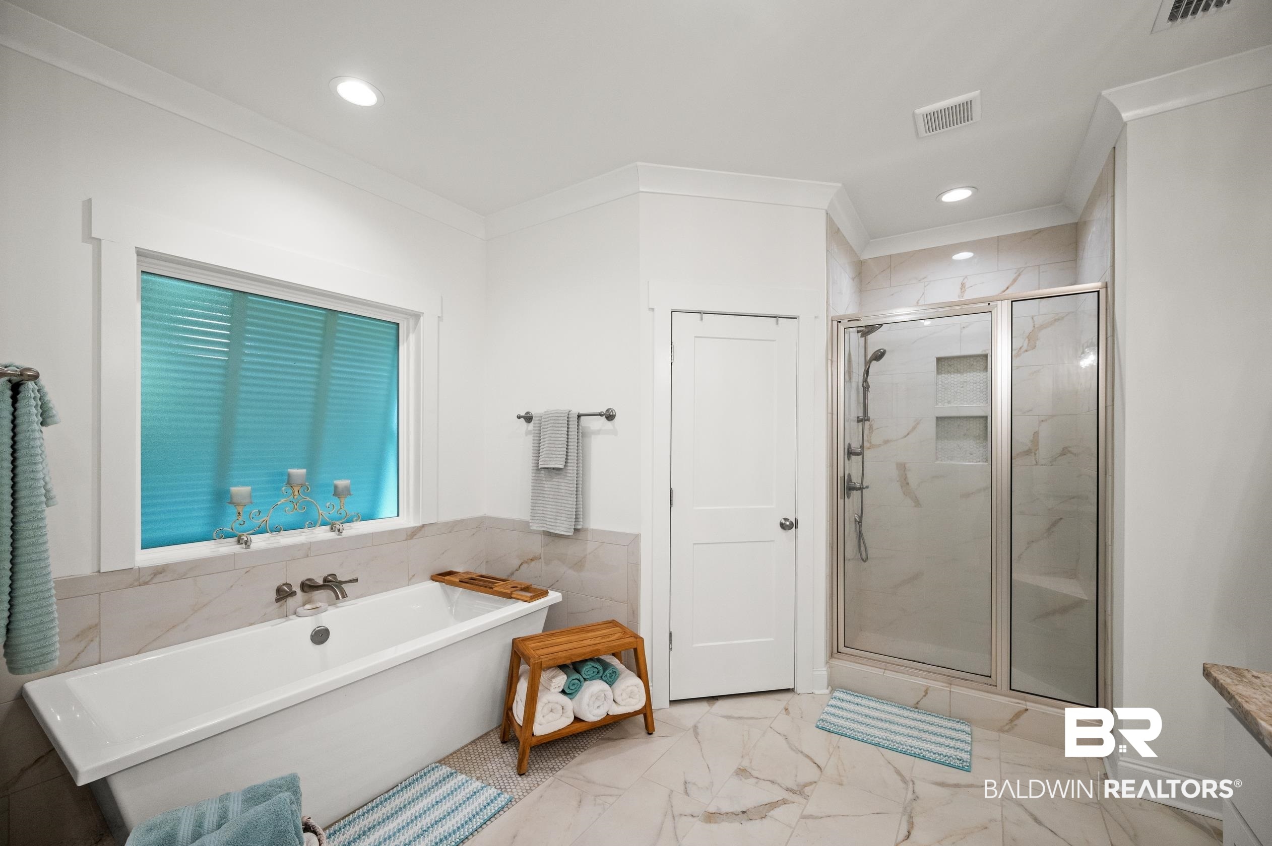 4601 Surrey Lane Orange Beach, AL 36561 - Photo 24 of 43 Bathroom featuring vanity, separate shower and tub, and ornamental molding