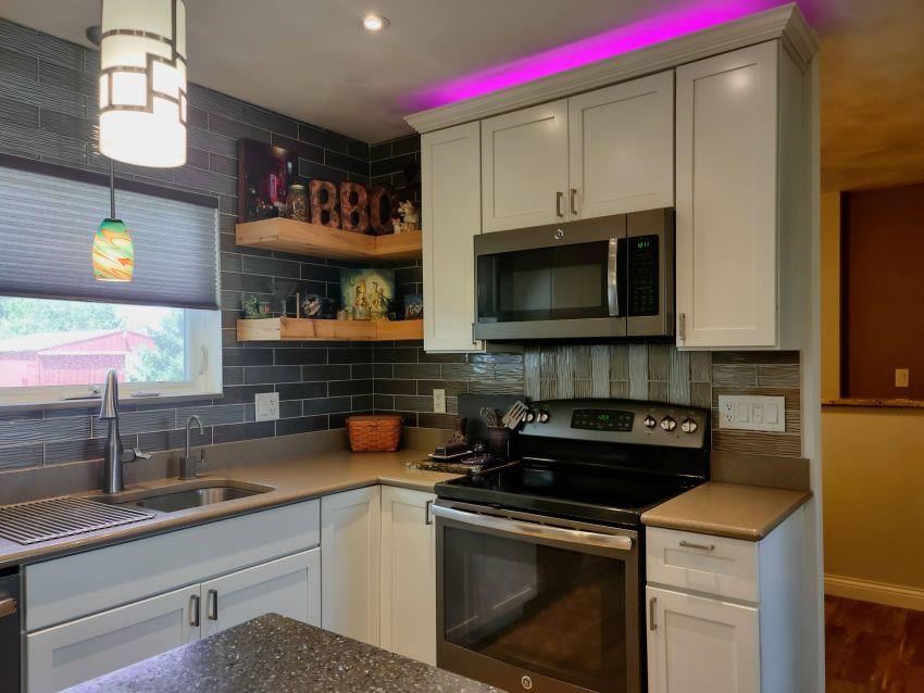 15724 Capron Road Capron, IL 61012 - Photo 8 of 35 a kitchen with a sink a microwave and cabinets