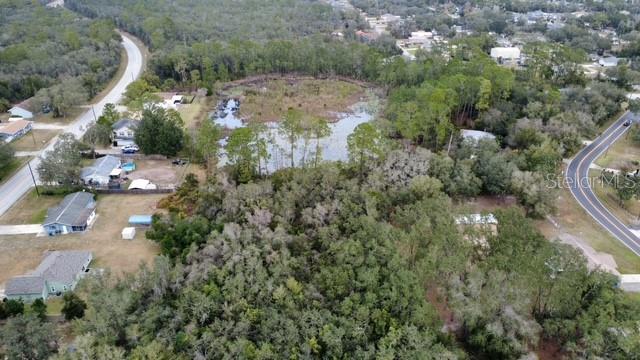 Periwinkle Drive DeLand, FL 32724 - Photo 2 of 5 an aerial view of residential house with outdoor space and trees all around