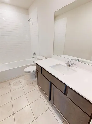 a bathroom with a sink a toilet and bathtub