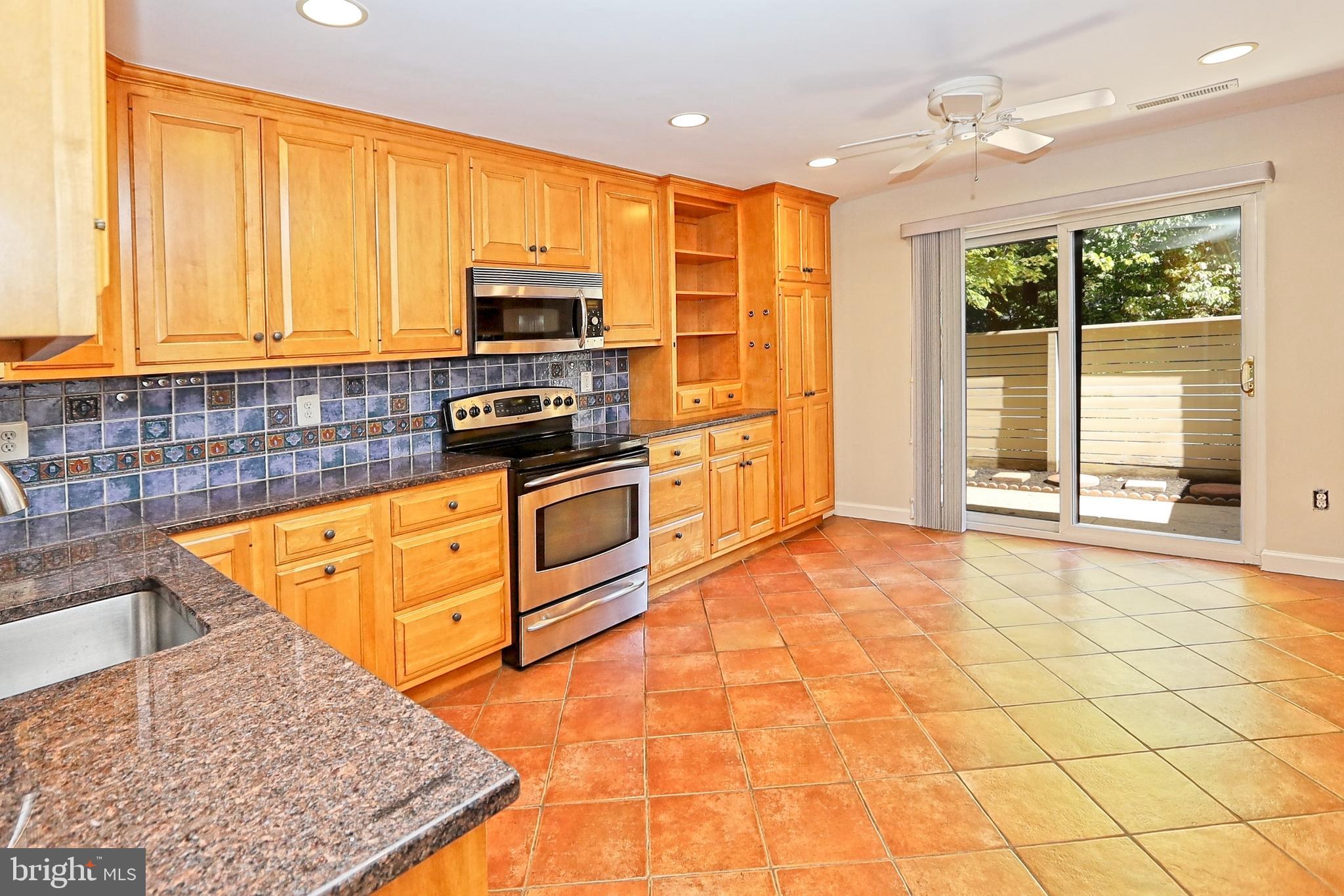 11633 Hunters Green Court Reston, VA 20191 - Photo 8 of 53 Ceramic tile leads to glass slider to front patio