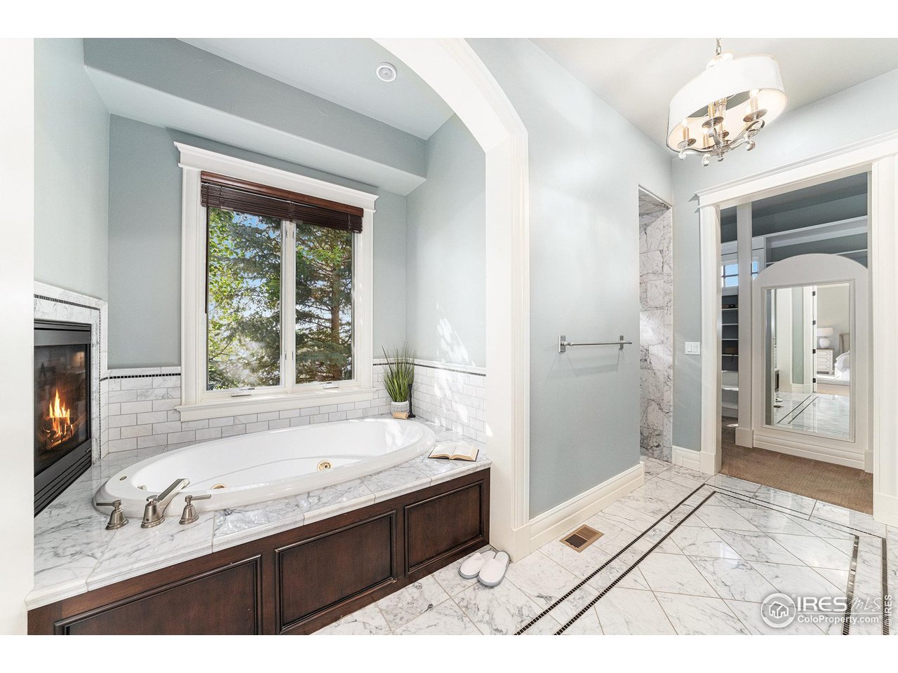 6344 Rookery Road Fort Collins, CO 80528 - Photo 23 of 40 a spacious bathroom with a tub sink and mirror