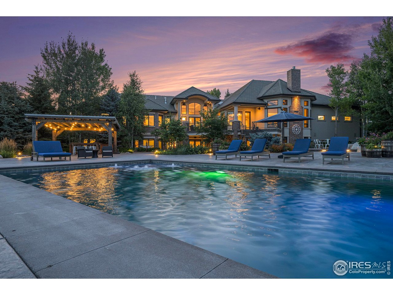 6344 Rookery Road Fort Collins, CO 80528 - Photo 6 of 40 an outdoor space with swimming pool and furniture