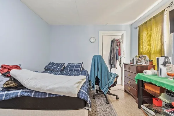 a bedroom with furniture and a bed