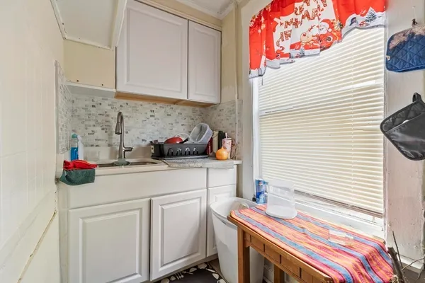 a kitchen with a sink and cabinets