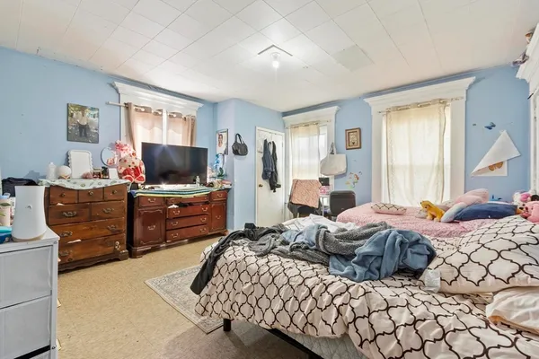 a bedroom with a bed and furniture