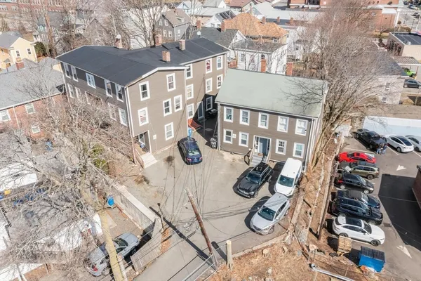 a view of a patio with iron fence