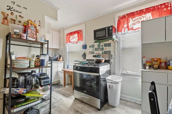a kitchen with a stove and a refrigerator