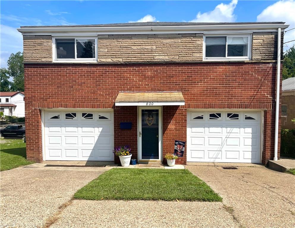 820 Etna Street McKees Rocks, PA 15136 - Photo 1 of 16 a front view of a house with a yard and garage