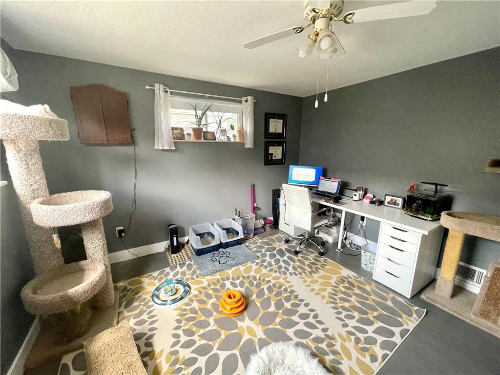 820 Etna Street McKees Rocks, PA 15136 - Photo 11 of 16 a room with furniture a rug and a chandelier
