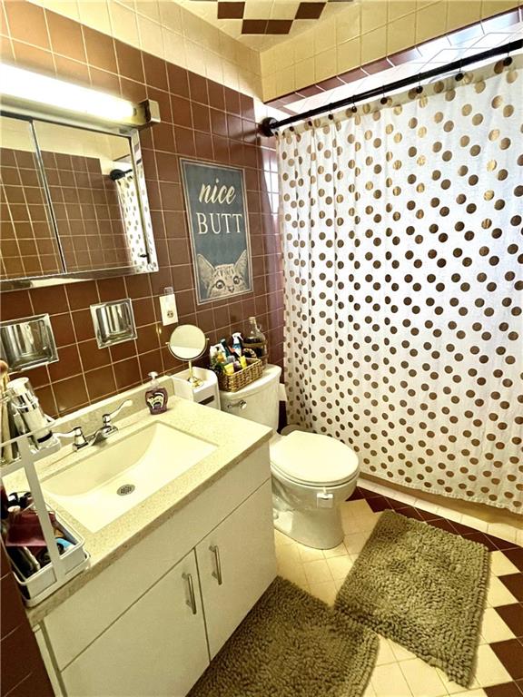 820 Etna Street McKees Rocks, PA 15136 - Photo 12 of 16 a bathroom with a sink toilet and shower