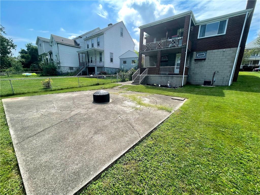 820 Etna Street McKees Rocks, PA 15136 - Photo 16 of 16 a view of a house with backyard and a tree