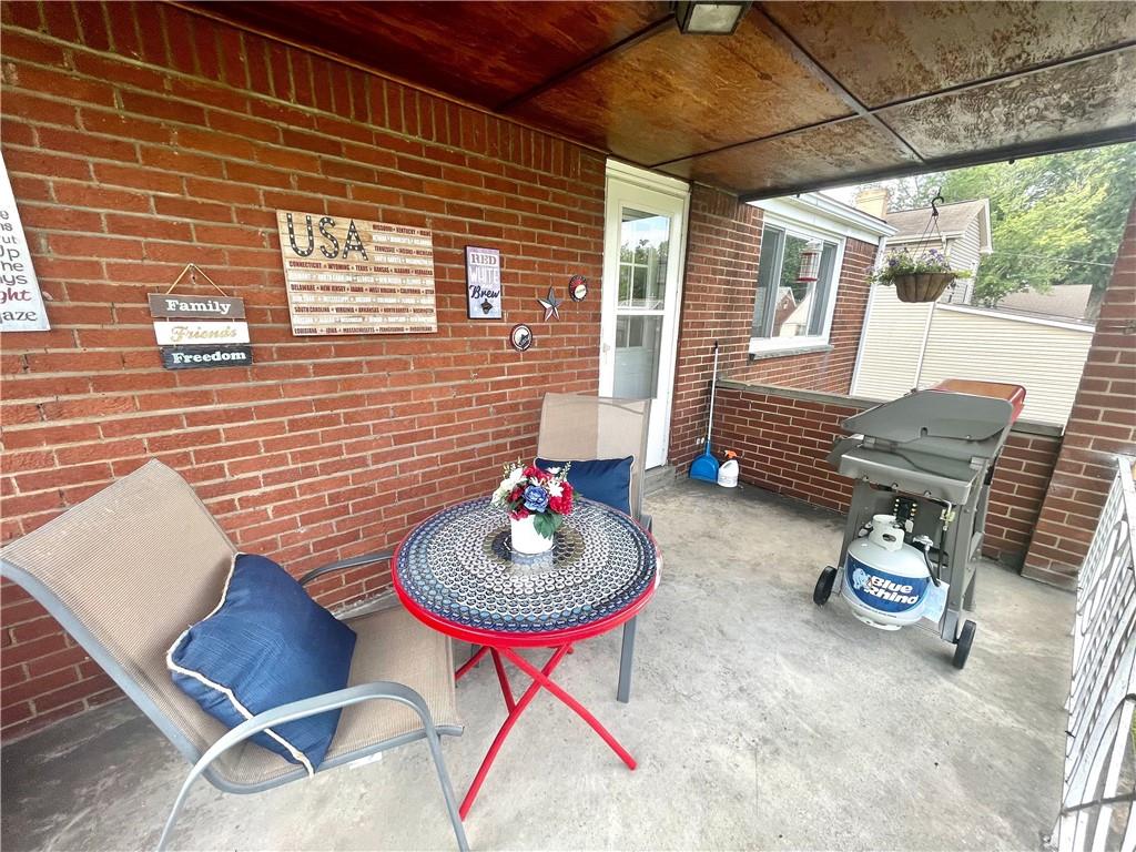 820 Etna Street McKees Rocks, PA 15136 - Photo 6 of 16 a backyard of a house with seating space