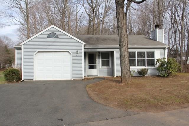 2415 Shepard Avenue, Unit 52 Hamden, CT 06518 - Photo 1 of 1 a front view of a house with a garden and yard