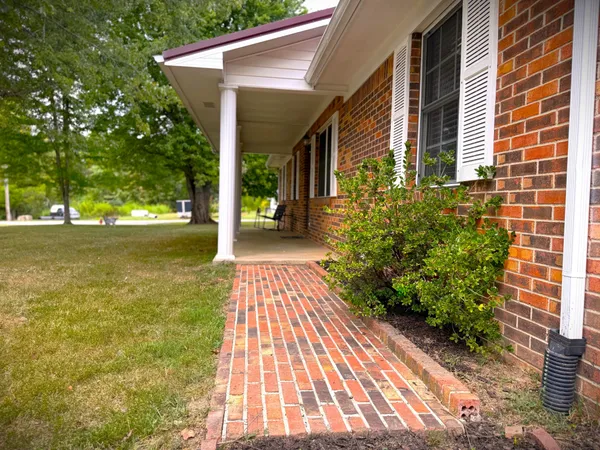 a spacious bedroom with a bed and a couch
