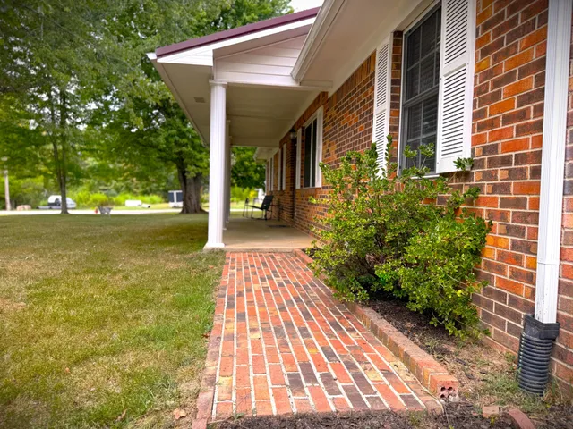 a spacious bedroom with a bed and a couch