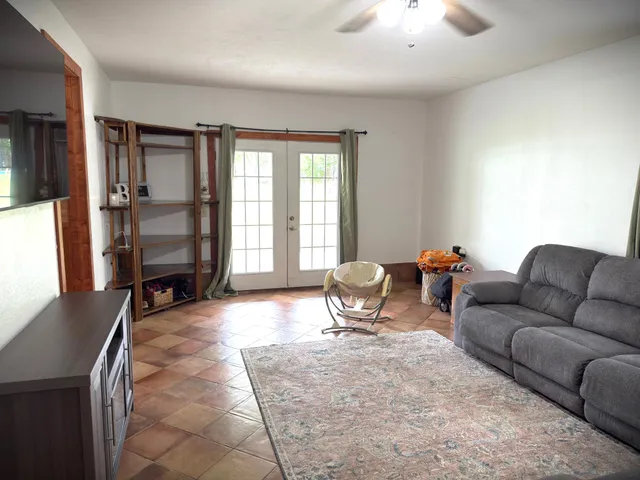 a living room with furniture and a table