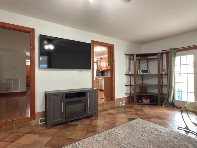 a kitchen with granite countertop wooden cabinets and stainless steel appliances