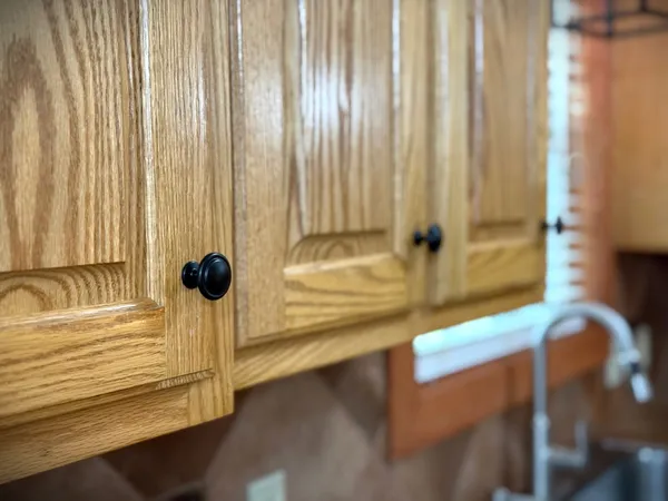 a kitchen with granite countertop a refrigerator stove and microwave