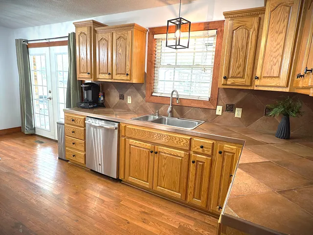 a bedroom with furniture and a wooden floor