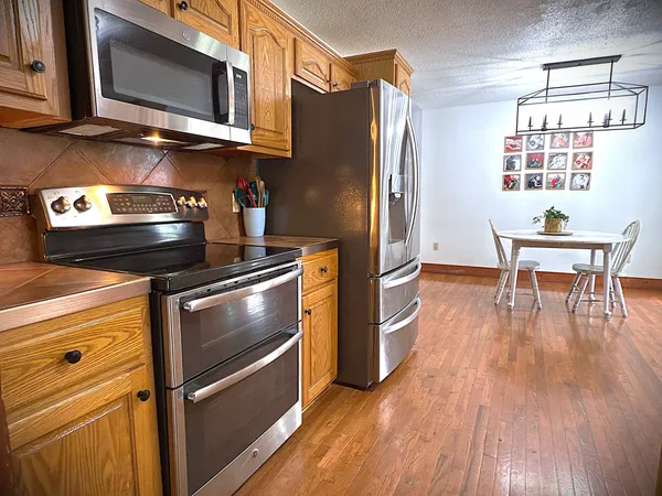 a view of a bathroom with a tub and shower