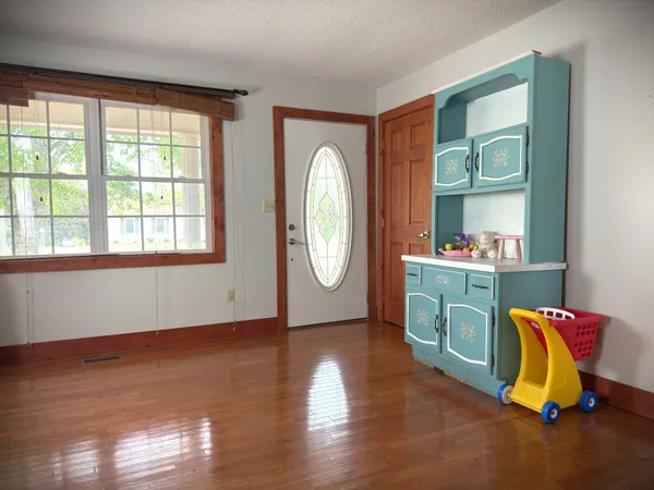 a bathroom with a sink vanity mirror and toilet