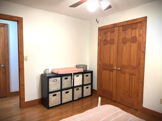 a view of a small space with wooden floor