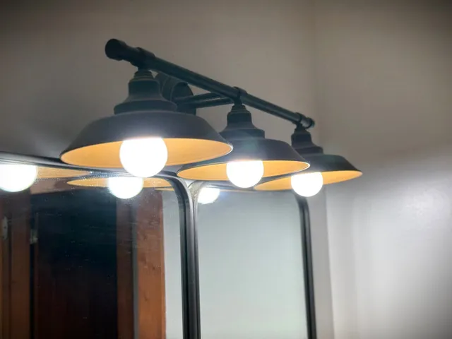 a bathroom with a shower a toilet and a sink