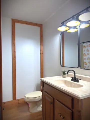 a view of a room with two chairs and a table