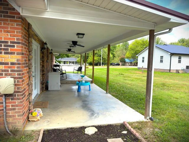 a view of a table and chairs in the garden