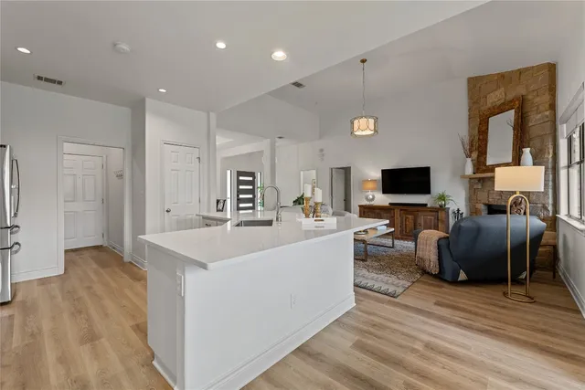 a living room with furniture and flat screen tv
